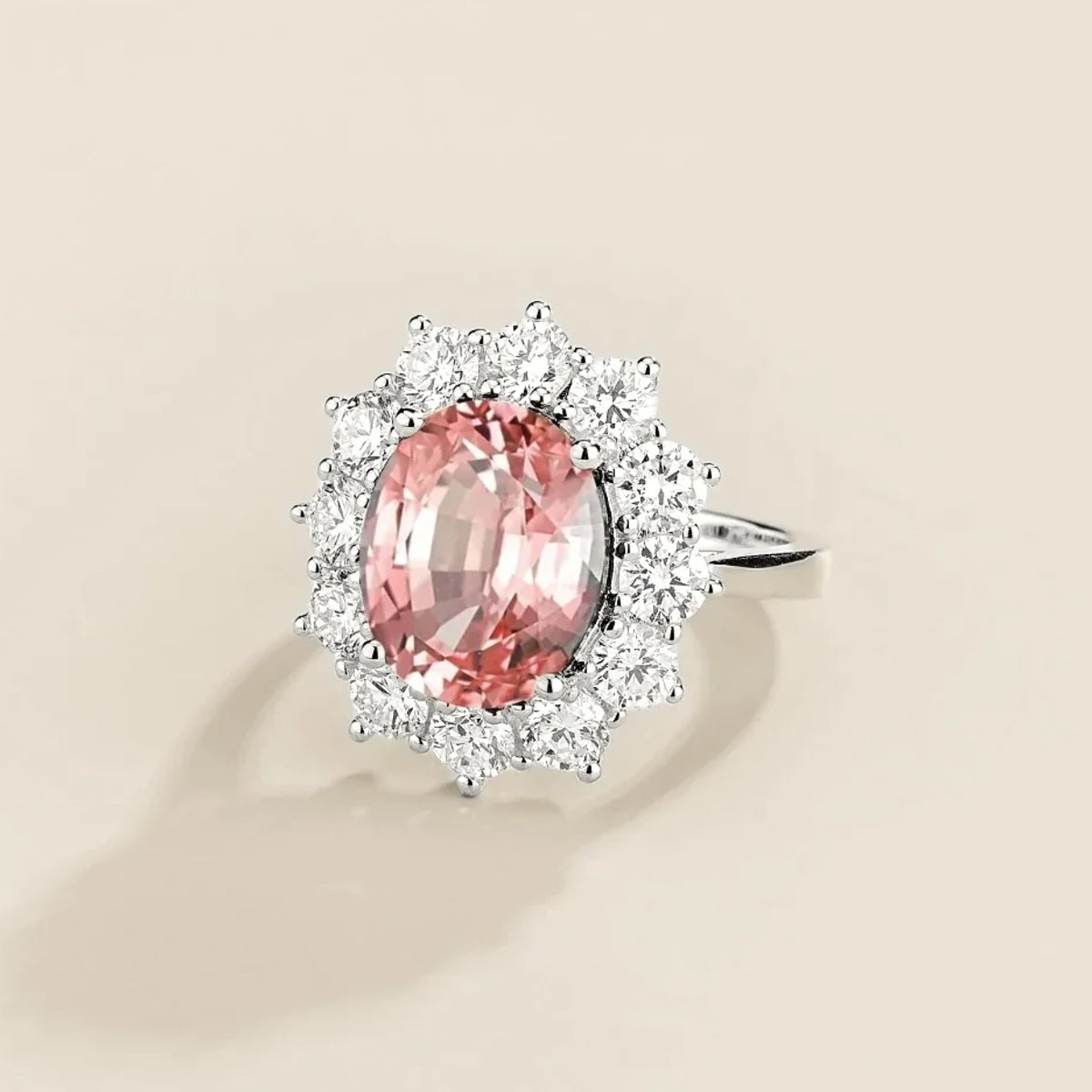 Oda Padparadscha Sapphire Oval & Diamond Halo Ring in White Gold – angle view