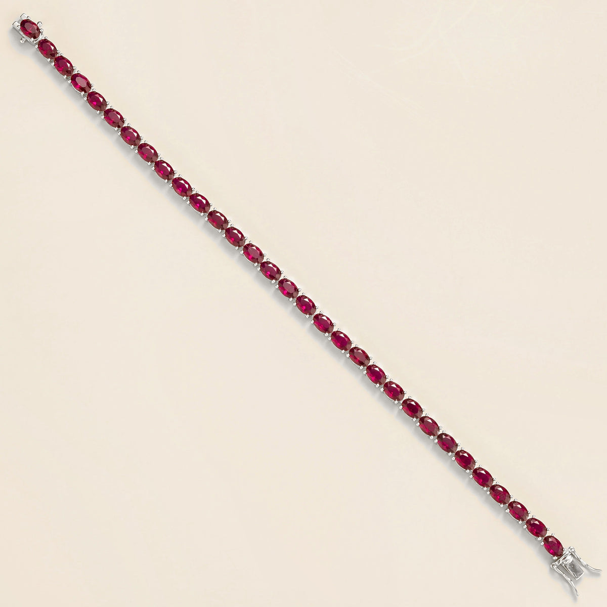 Oval Ruby Tennis Bracelet in White Gold – close-up of the setting