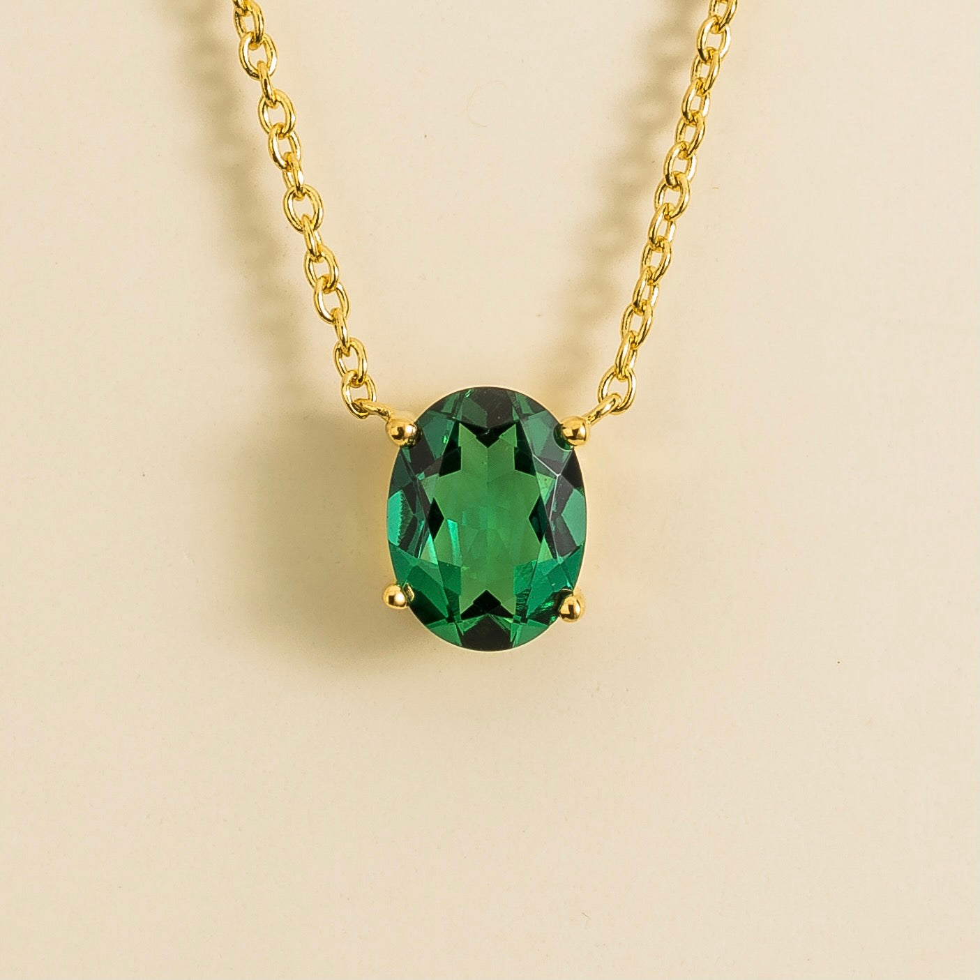 Ova gold necklace set with Emerald By Juvetti Online Jewellery London