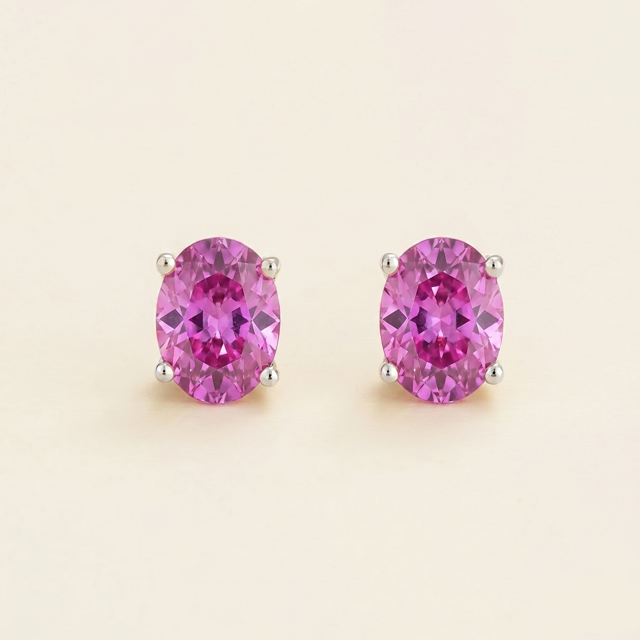 Oval lab-grown vivid pink sapphire stud earrings, Ovo design in white gold | Juvetti London