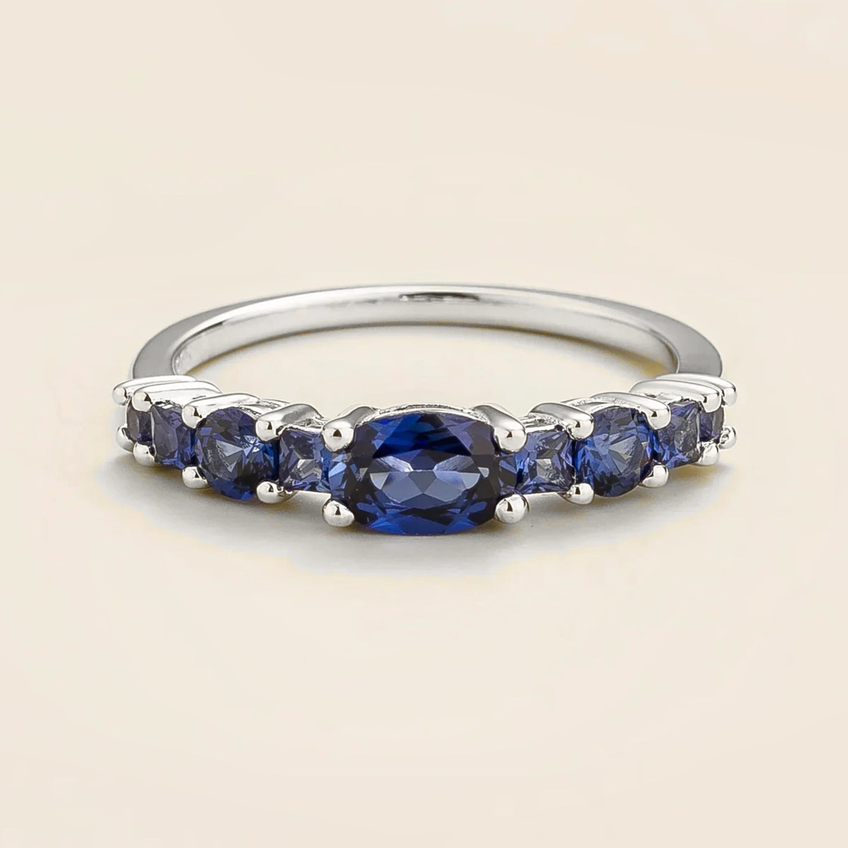 Petra Blue Sapphire Graduated Band Ring in White Gold | Juvetti