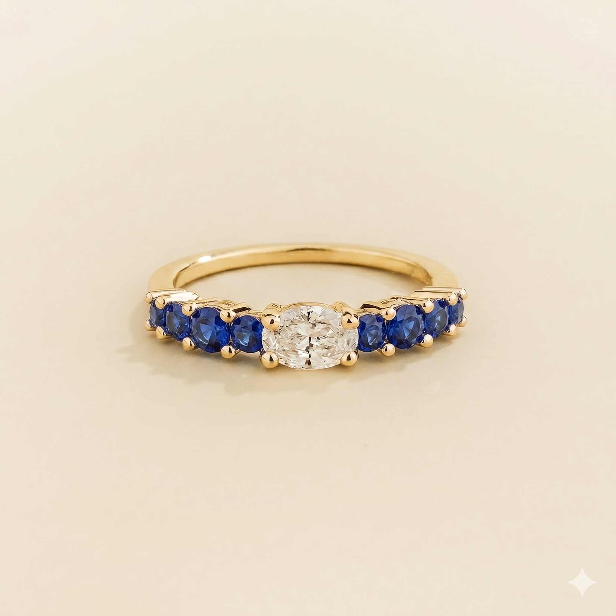 Petra Oval Diamond and Blue Sapphire Half Eternity Ring in Gold