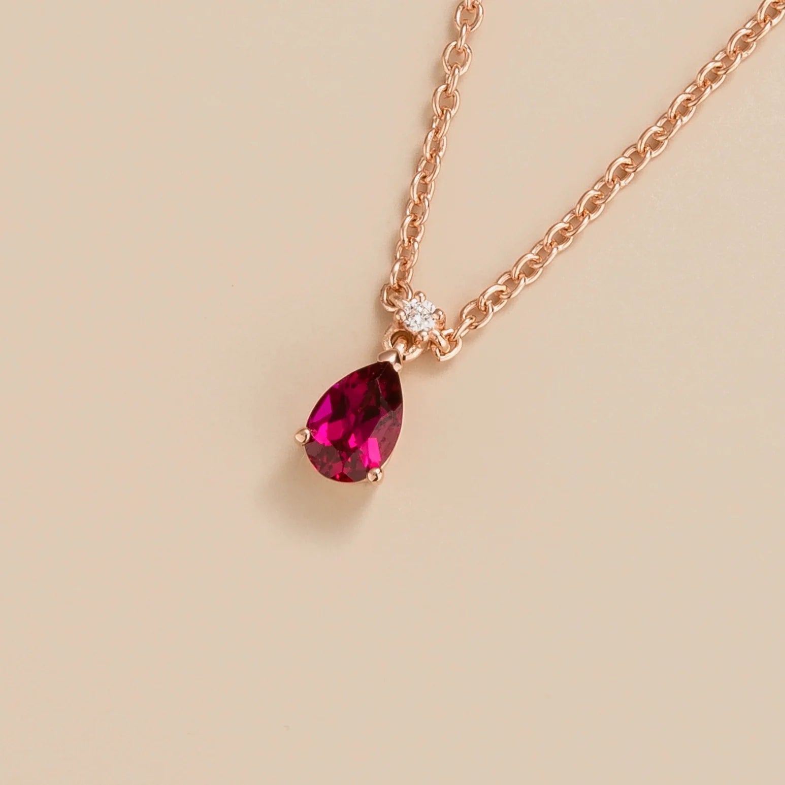 Ori pear drop necklace in 18K pink gold vermeil set with lab grown ruby and diamond gem stones.