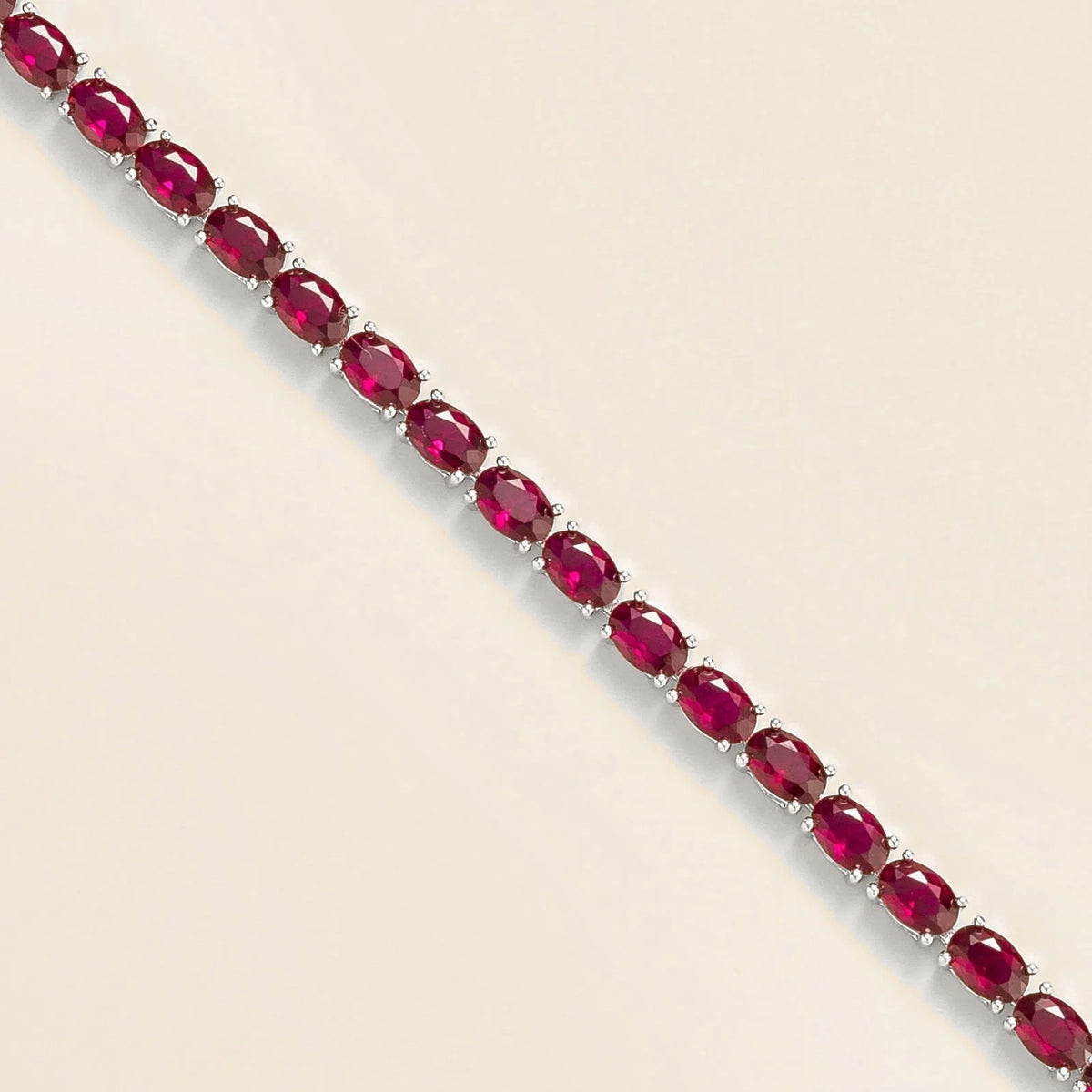 Oval Ruby Tennis Bracelet in White Gold – front view