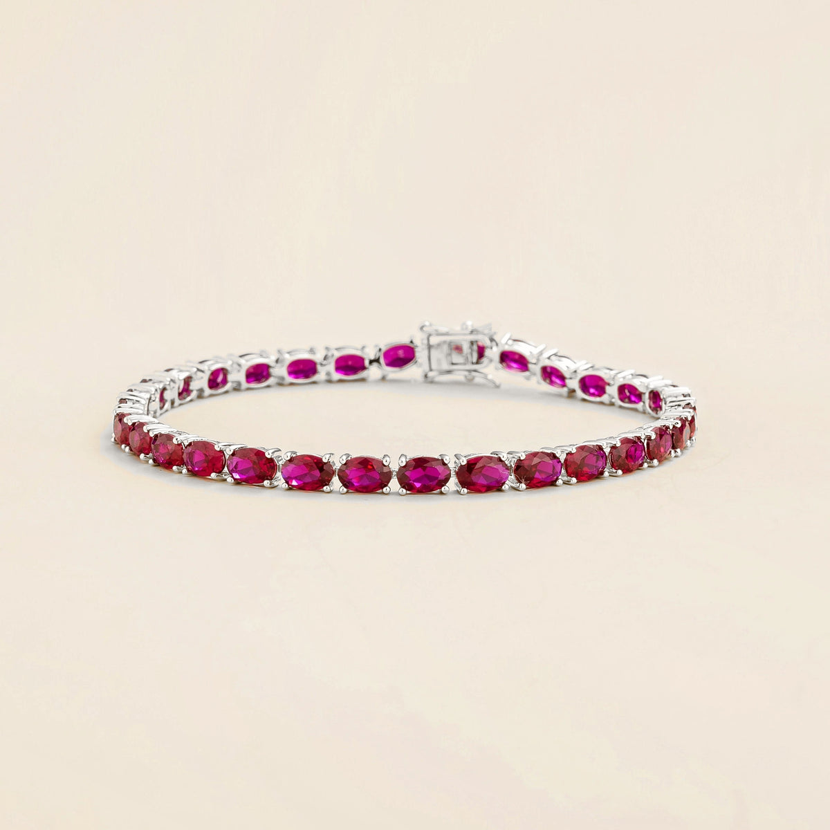 Oval Ruby Tennis Bracelet in White Gold