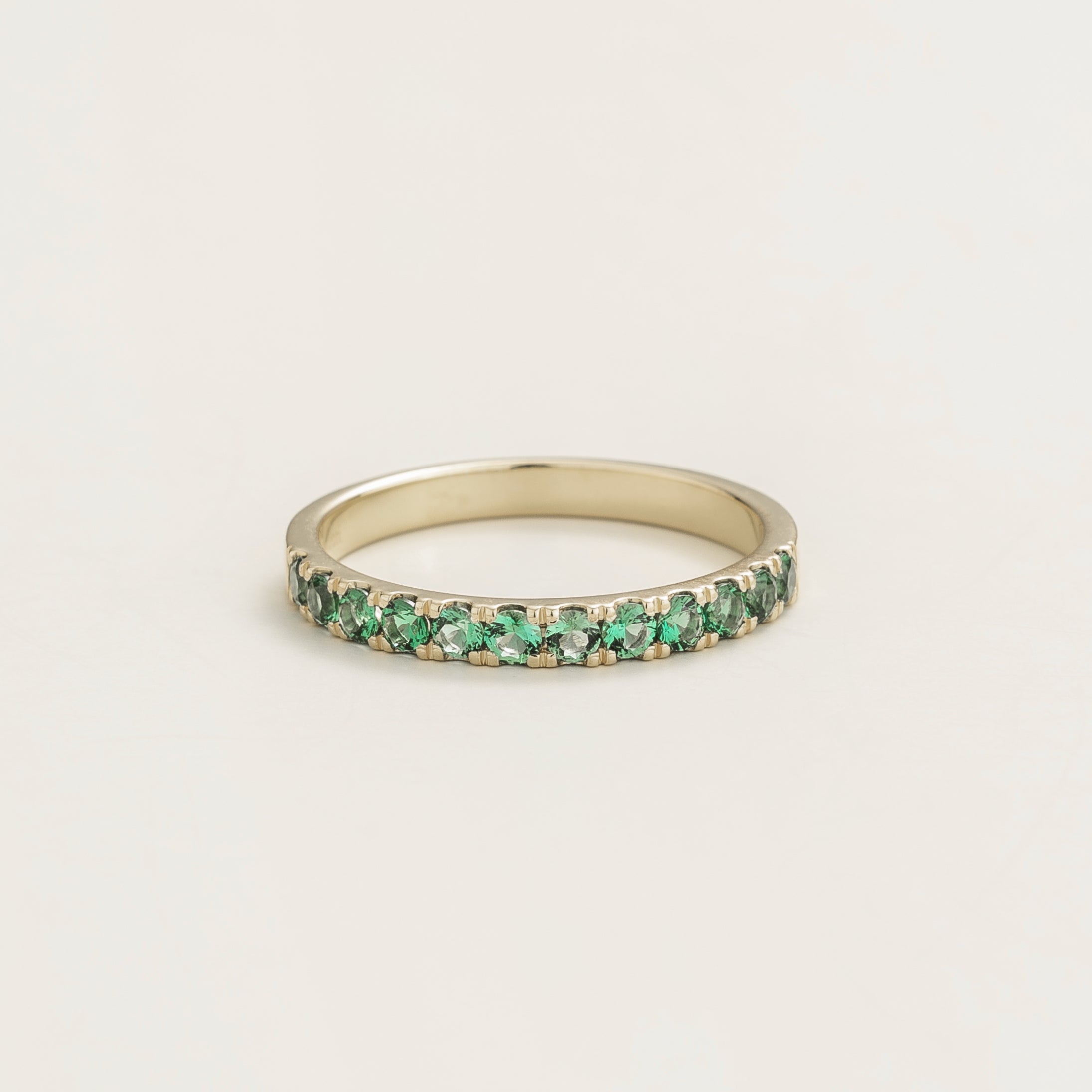 Salto White Gold Half Eternity Ring Set With Emerald by Juvetti