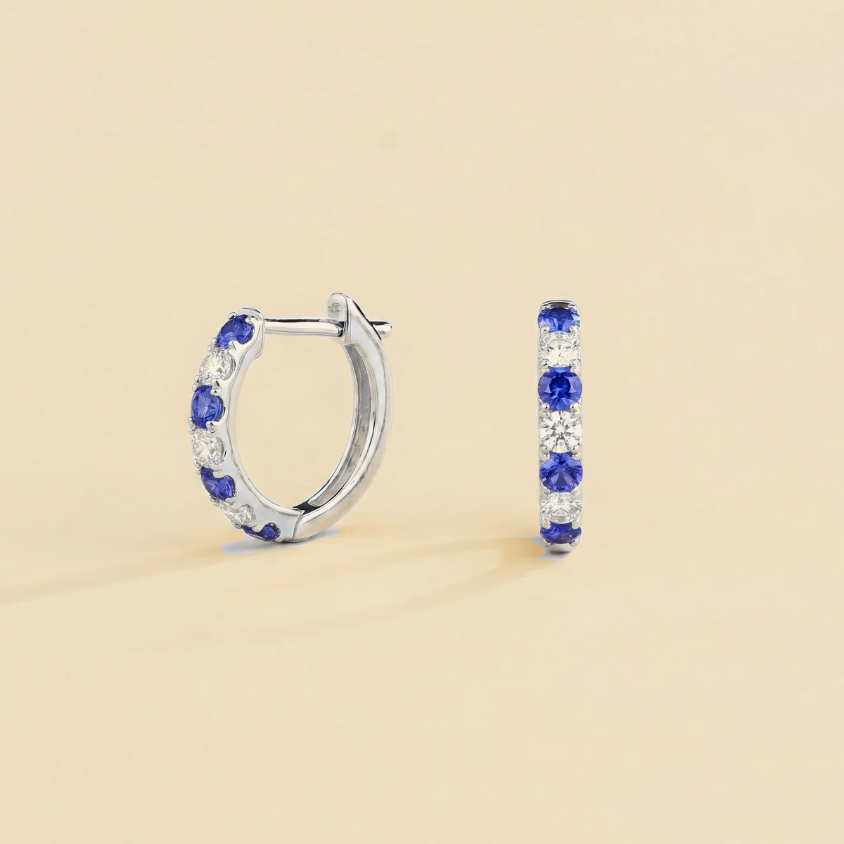 Stacy Blue Sapphire & Diamond Huggie Hoop Earrings in White Gold | Juvetti
