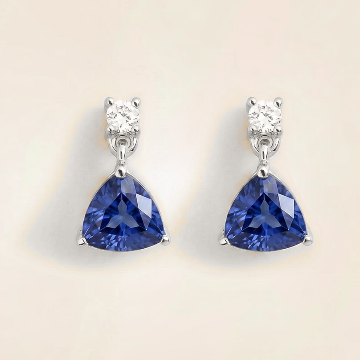 Trillion-cut lab-grown blue sapphire and diamond drop earrings in white gold | Juvetti London