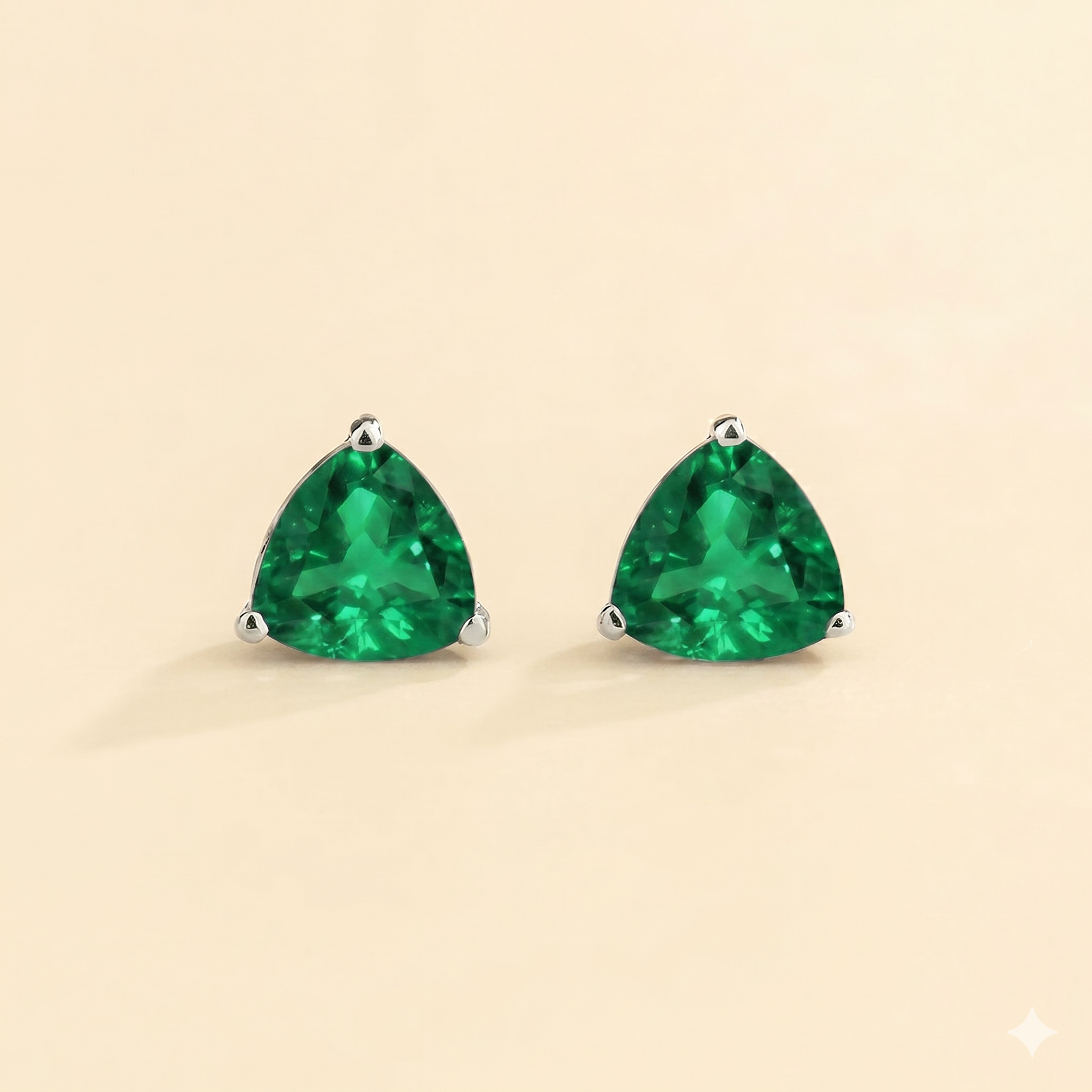Trillion Emerald Solitaire Stud Earrings in White Gold
