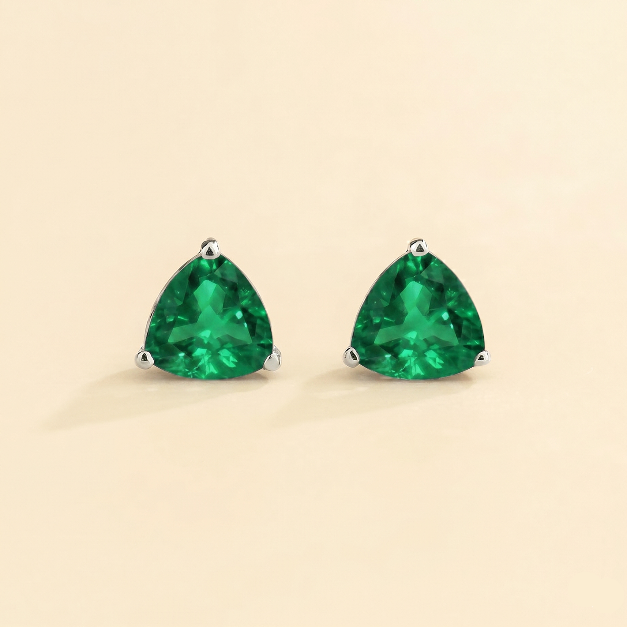 Trillion Emerald Solitaire Stud Earrings in White Gold