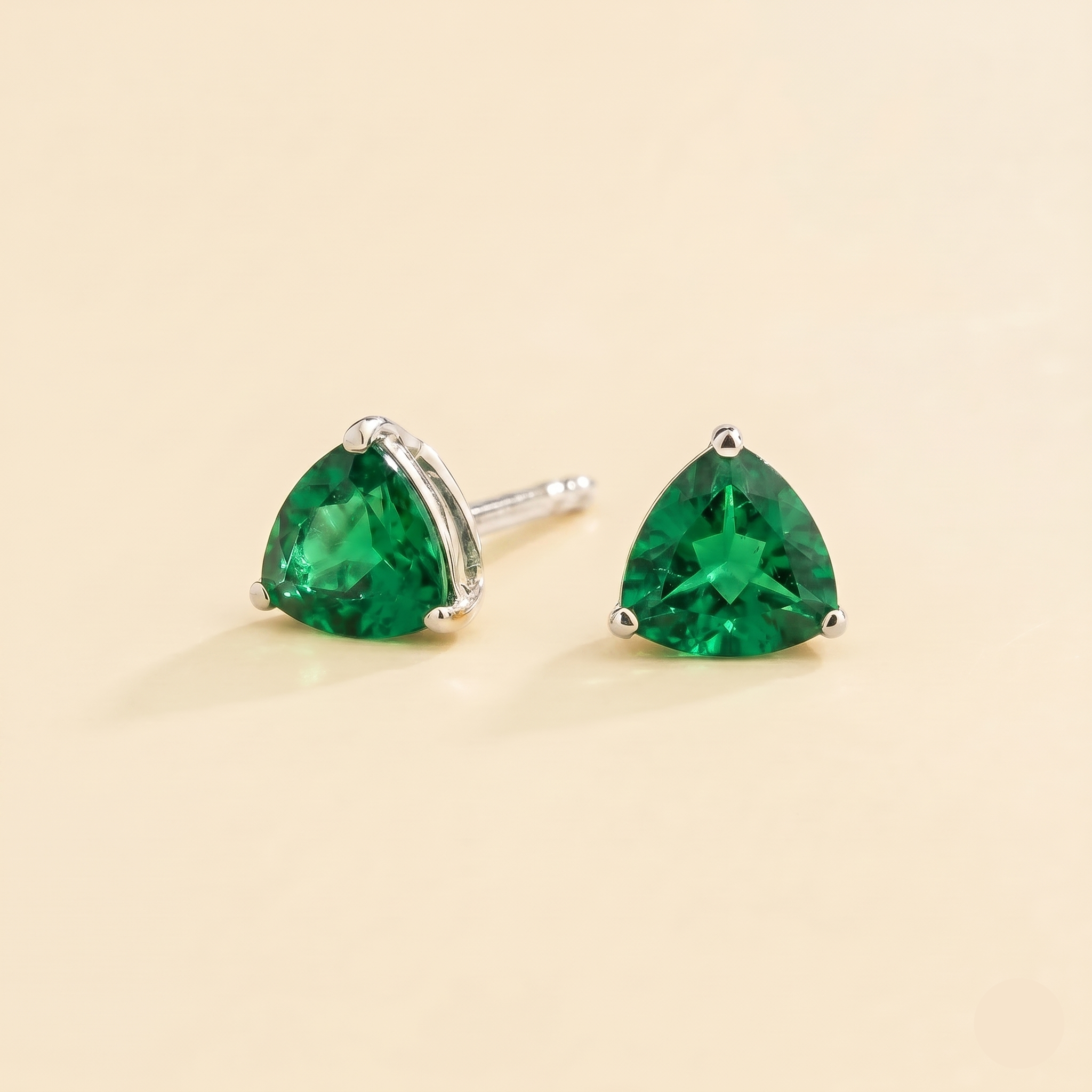 Trillion Emerald Solitaire Stud Earrings in White Gold