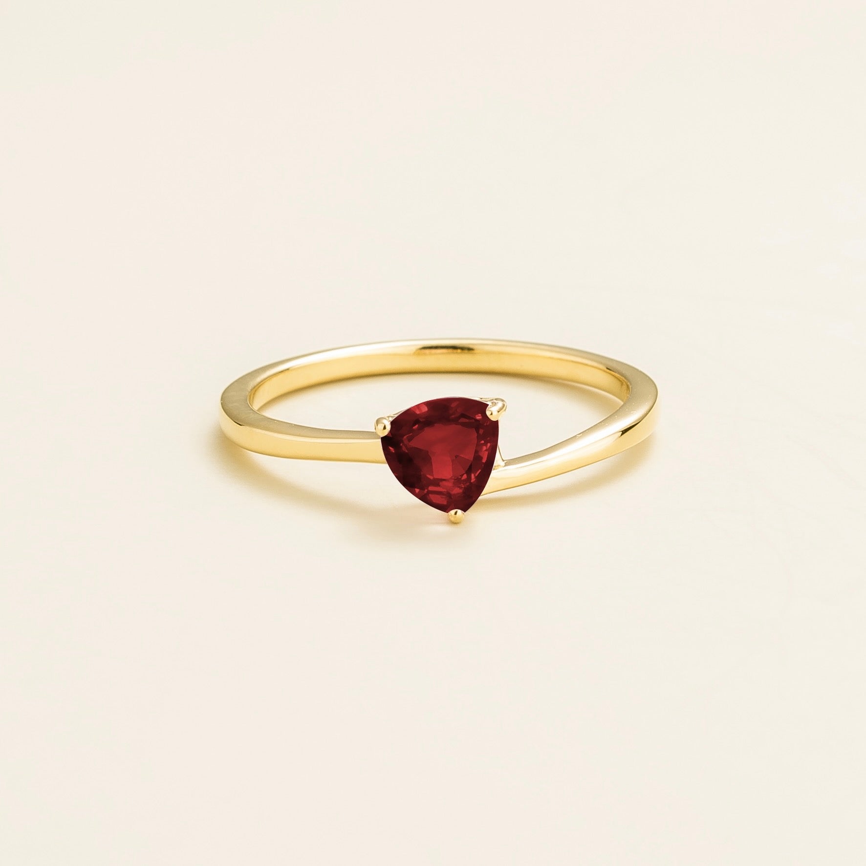 Elegant Gold Solitaire Ring Featuring Trillion Cut Ruby – Sustainable Luxury