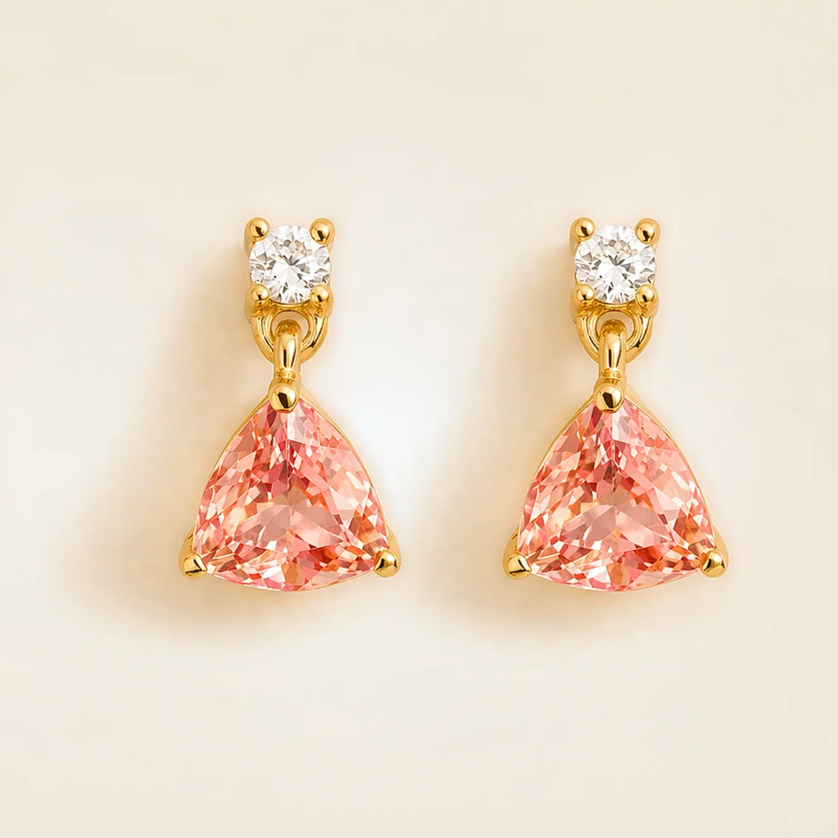 Trillion-cut lab-grown padparadscha sapphire and diamond drop earrings in gold | Juvetti London