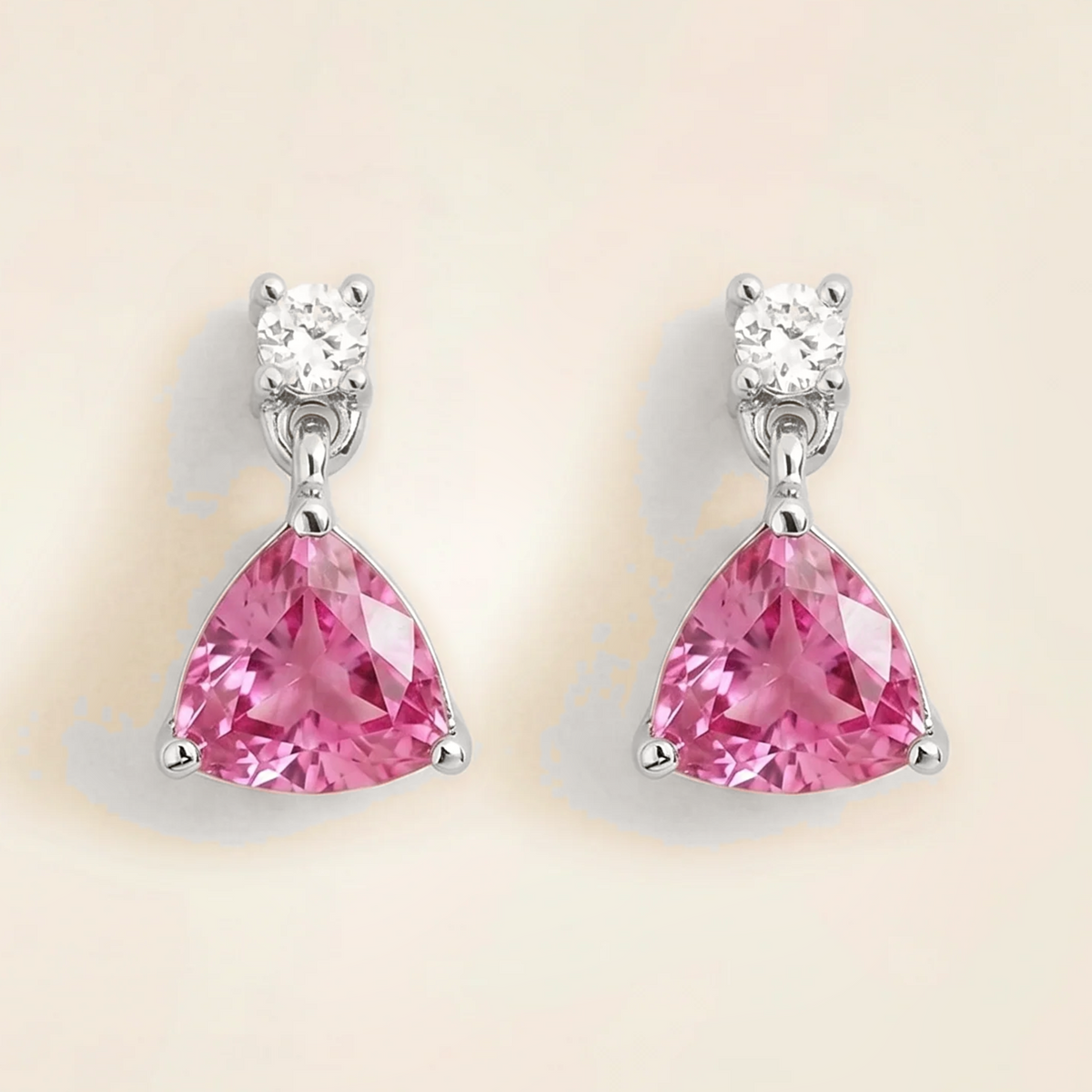 Trillion-cut lab-grown pink sapphire and diamond drop earrings in white gold | Juvetti London