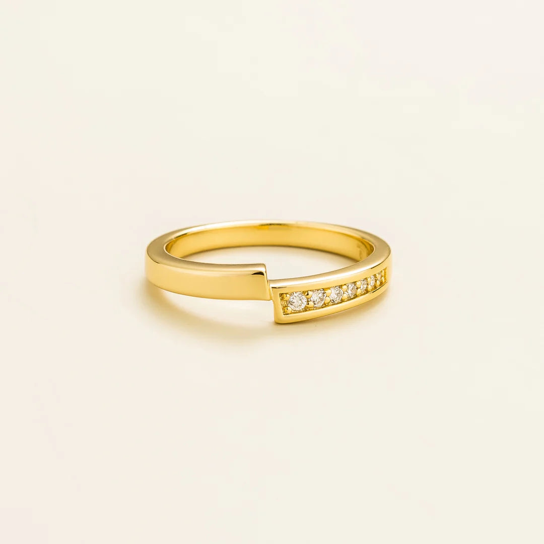 Elegant modern gold ring featuring offset band and pavƩ-set lab-grown diamonds