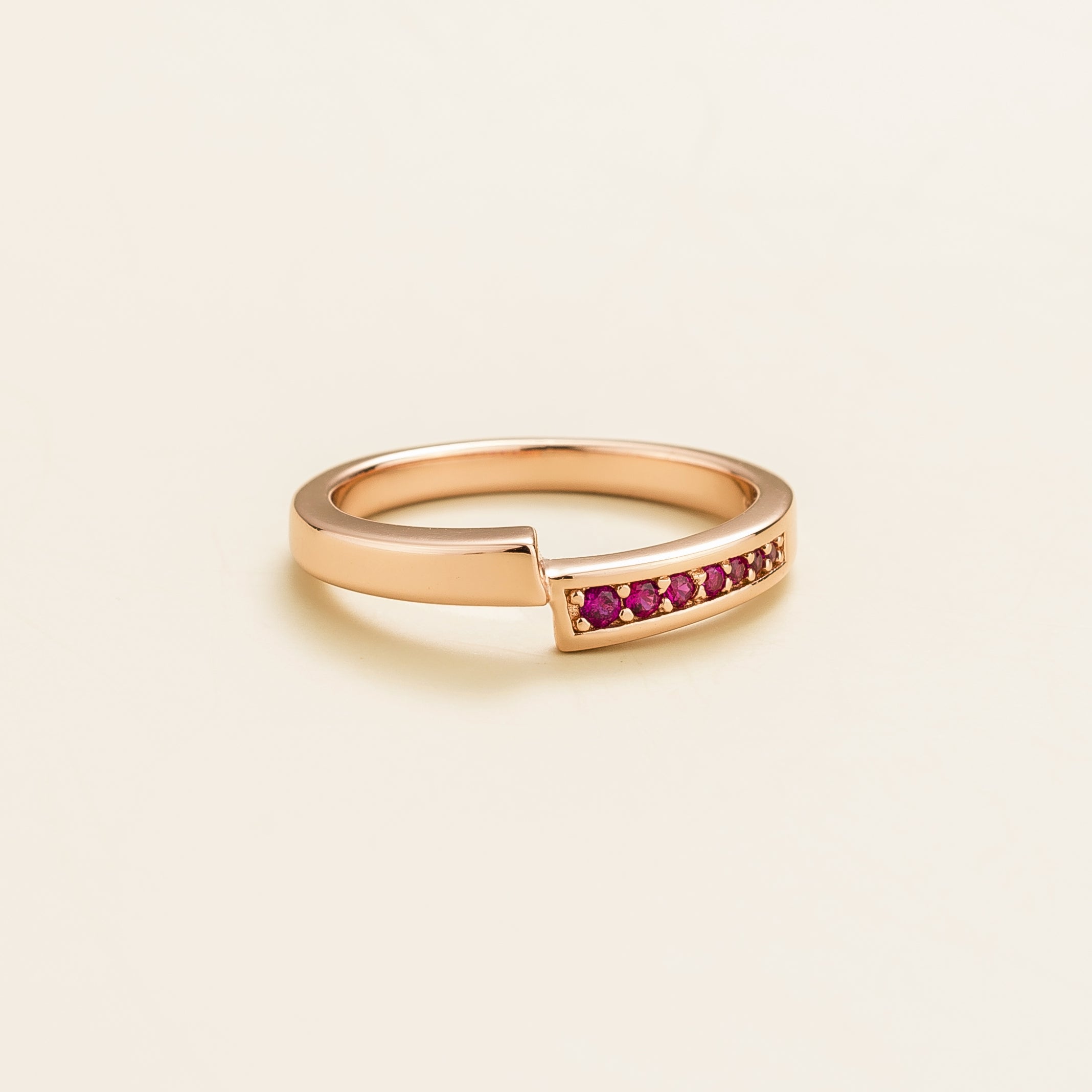 Elegant modern rose gold ring featuring offset band and pavé-set lab-grown ruby