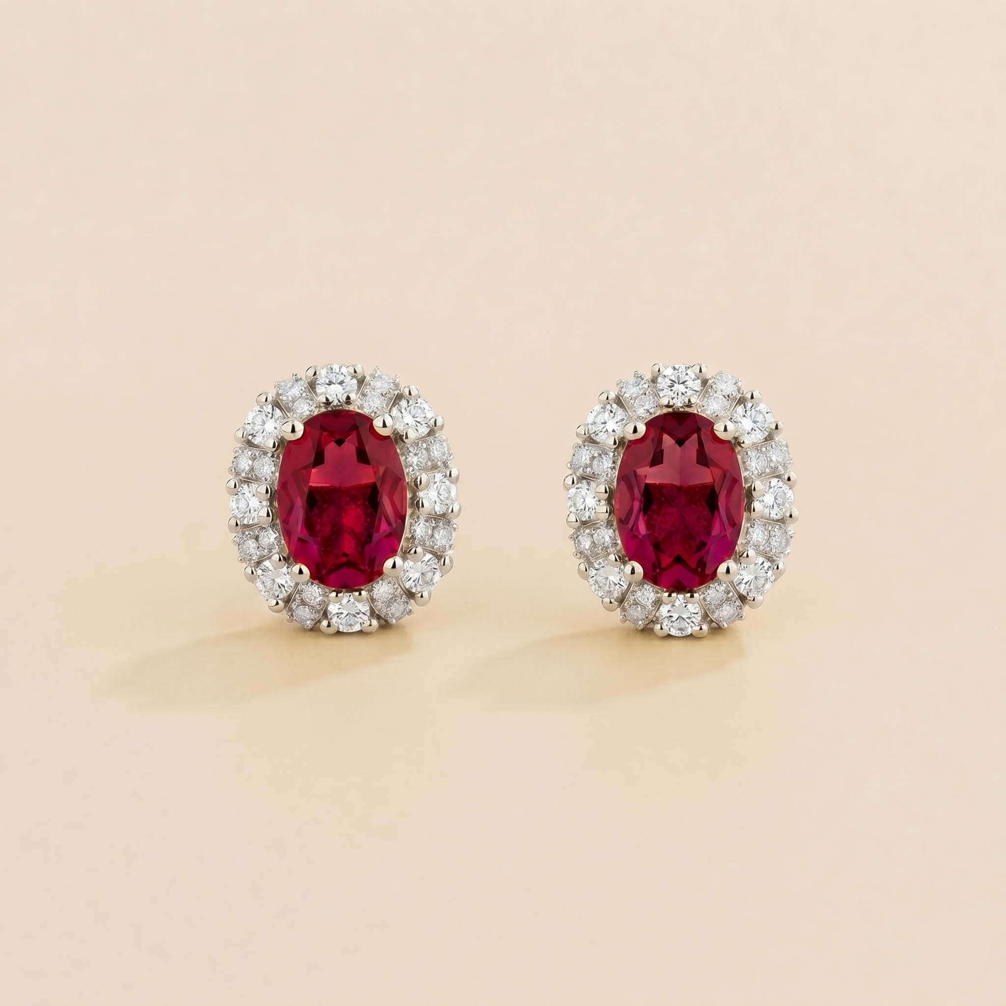 Viva Oval Ruby Halo Stud Earrings with Diamond Accents in White Gold