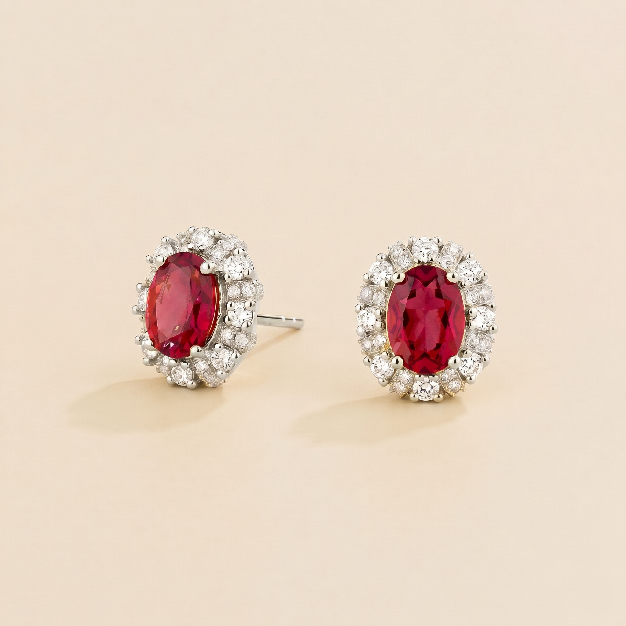Viva Oval Ruby Halo Stud Earrings with Diamond Accents in White Gold