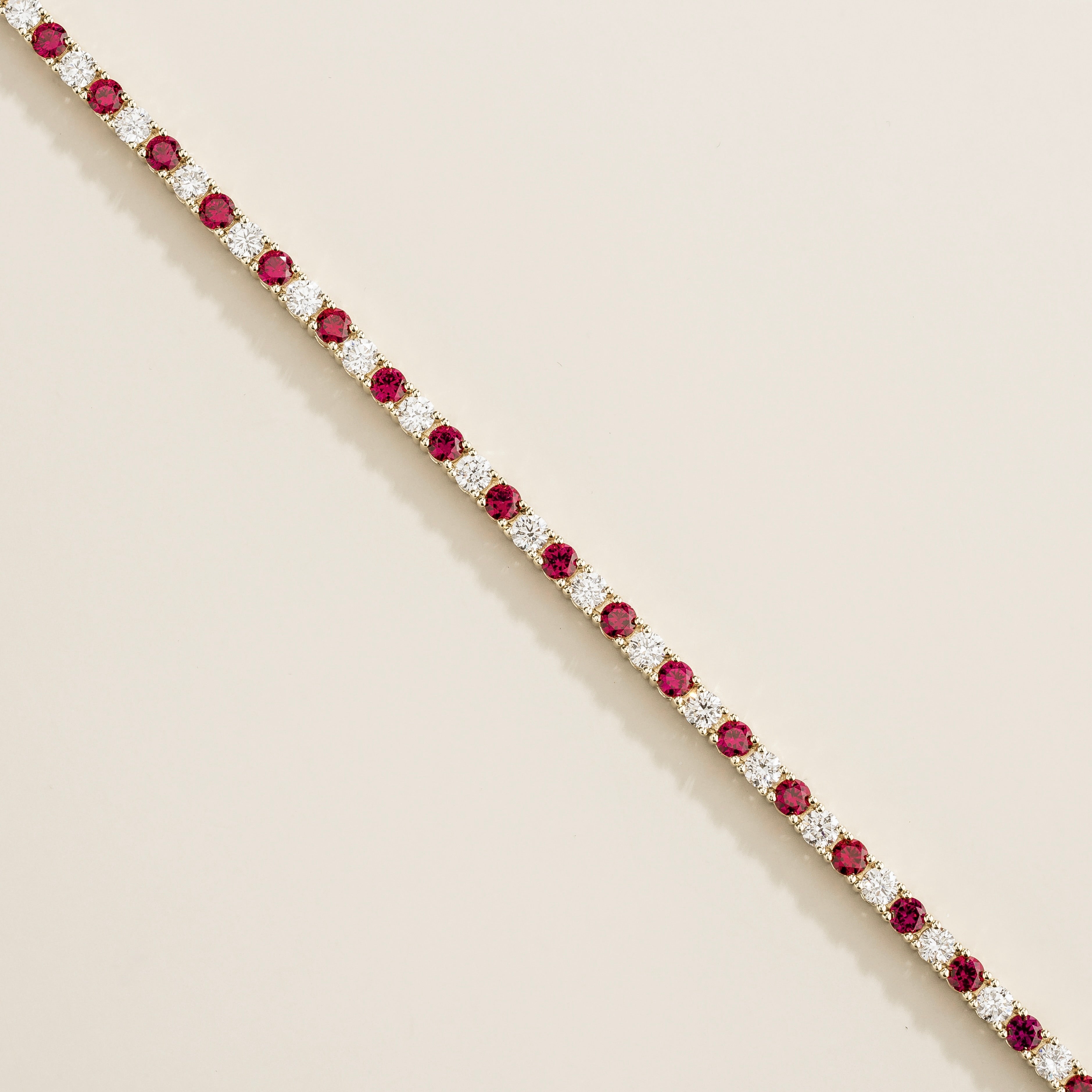 white gold bracelet featuring round ruby gemstones and lab grown diamonds