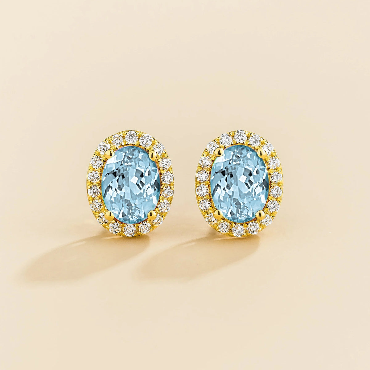 Lab-grown aquamarine and diamond oval halo stud earrings in gold – front view | Mina by Juvetti