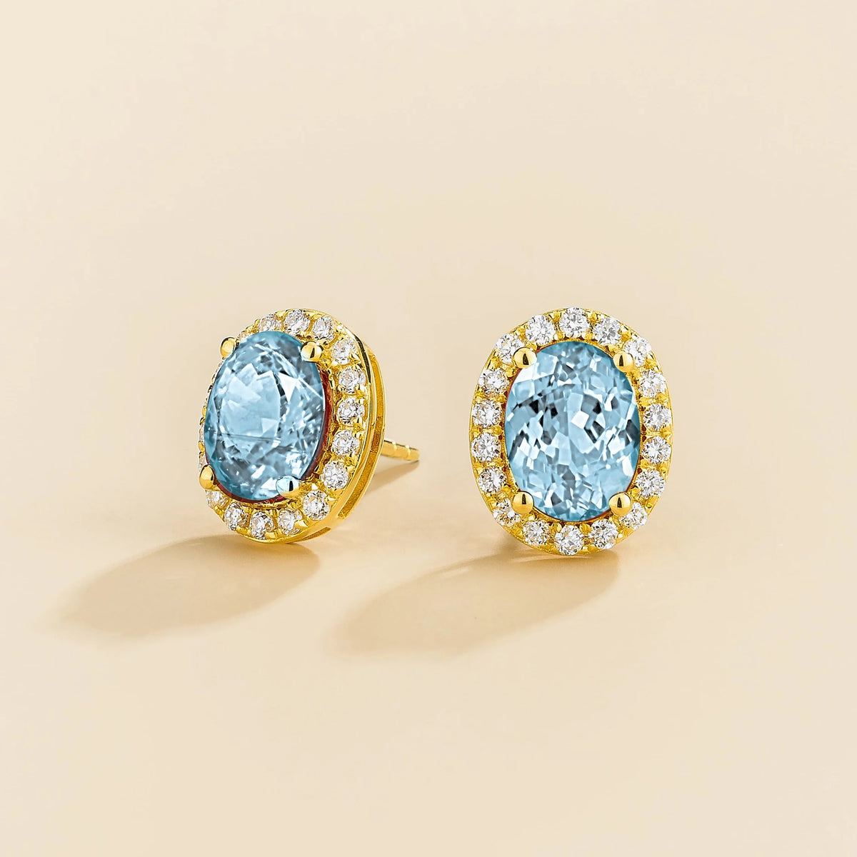 Lab-grown aquamarine and diamond oval halo stud earrings in gold – side view | Mina by Juvetti