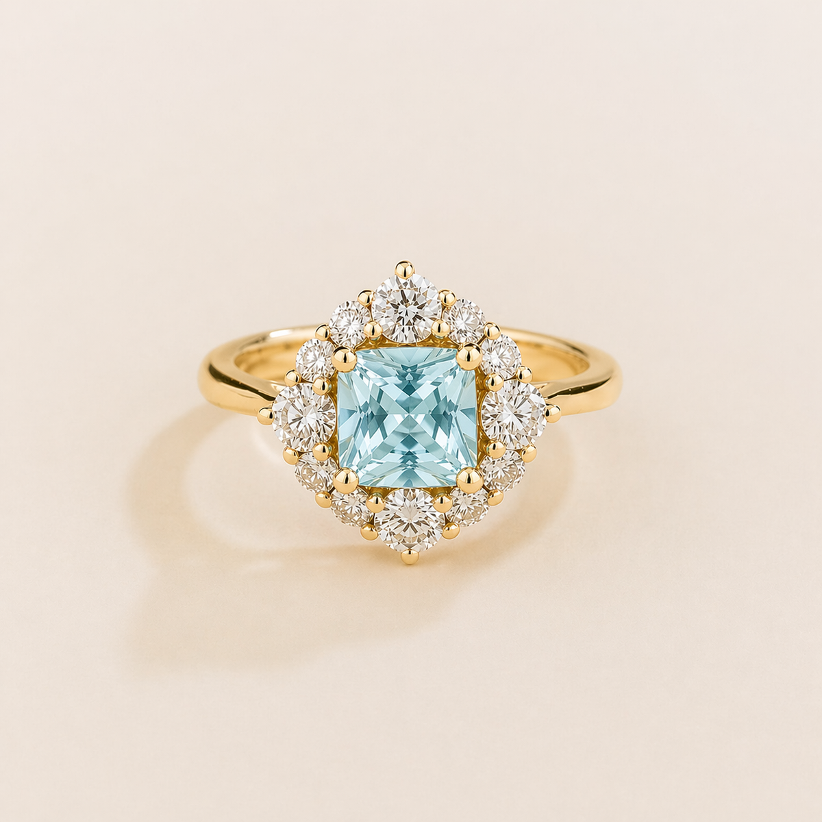 Tuli cushion-cut lab-grown aquamarine and diamond halo ring in gold – front view | Juvetti London