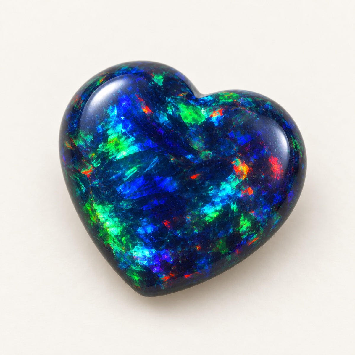 Black lab-grown opal, heart cabochon, 45° view