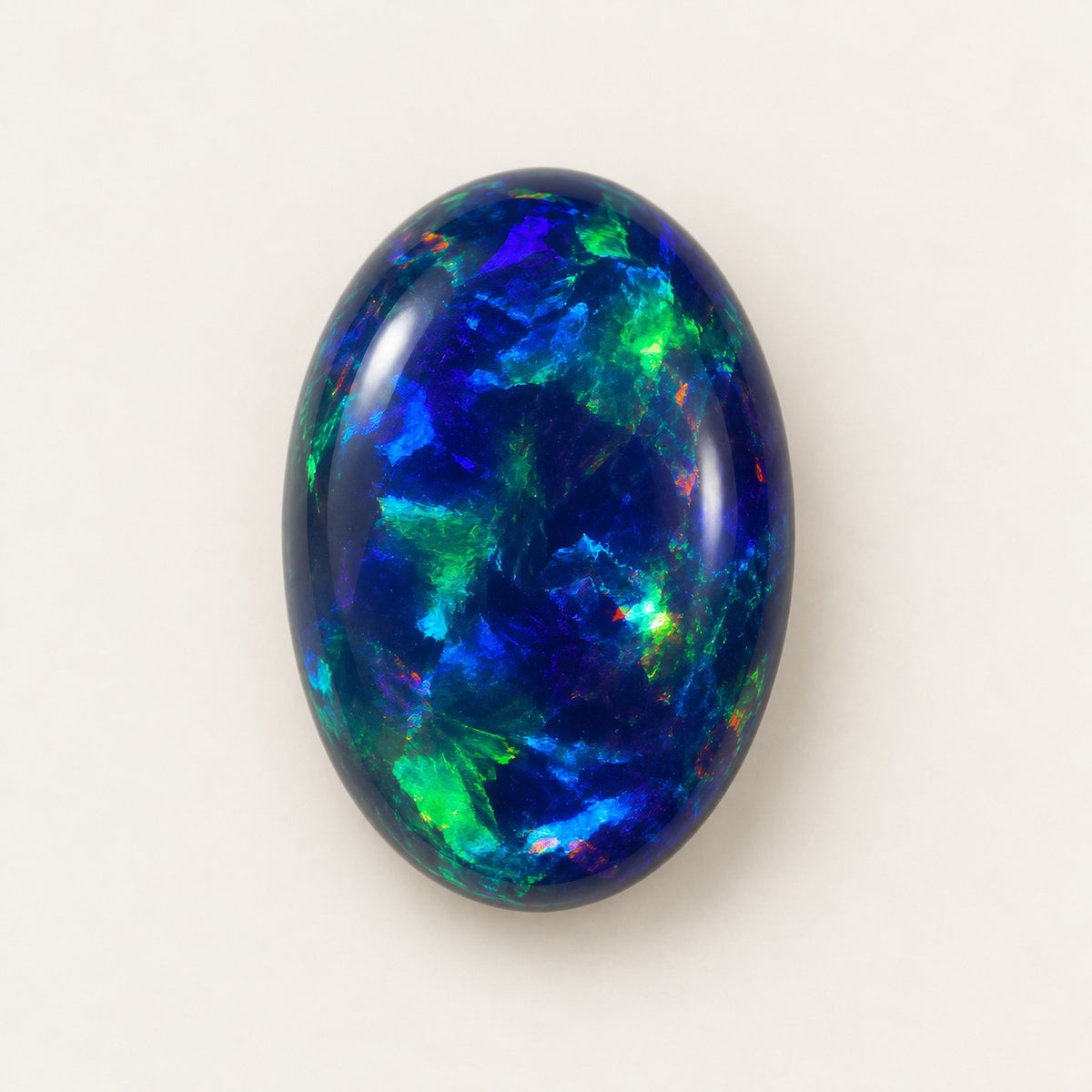 Black lab-grown opal, oval cabochon