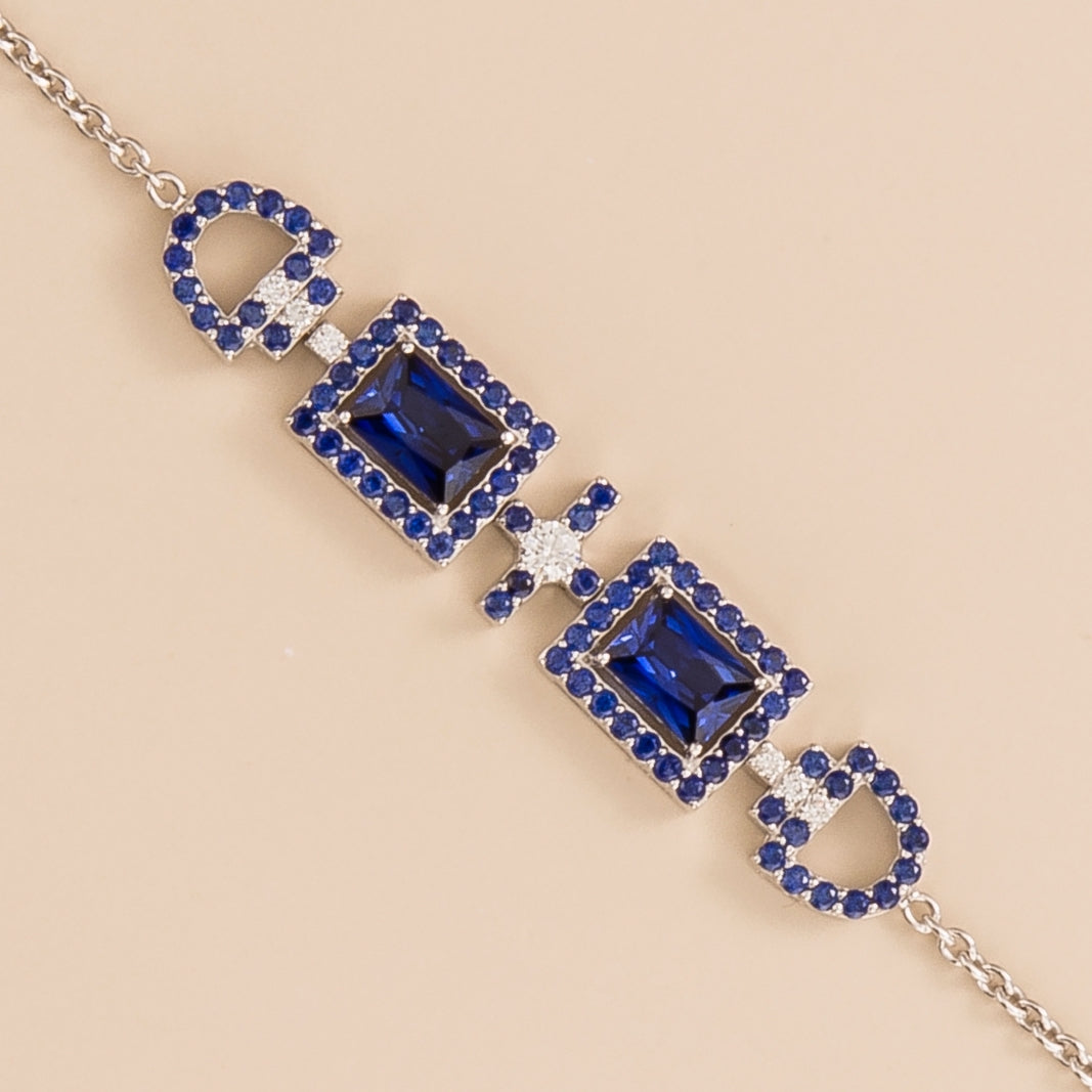 Ciceris blue sapphire Art Deco halo bracelet in white gold, two emerald-cut lab-grown sapphires with diamonds, close-up | Juvetti London