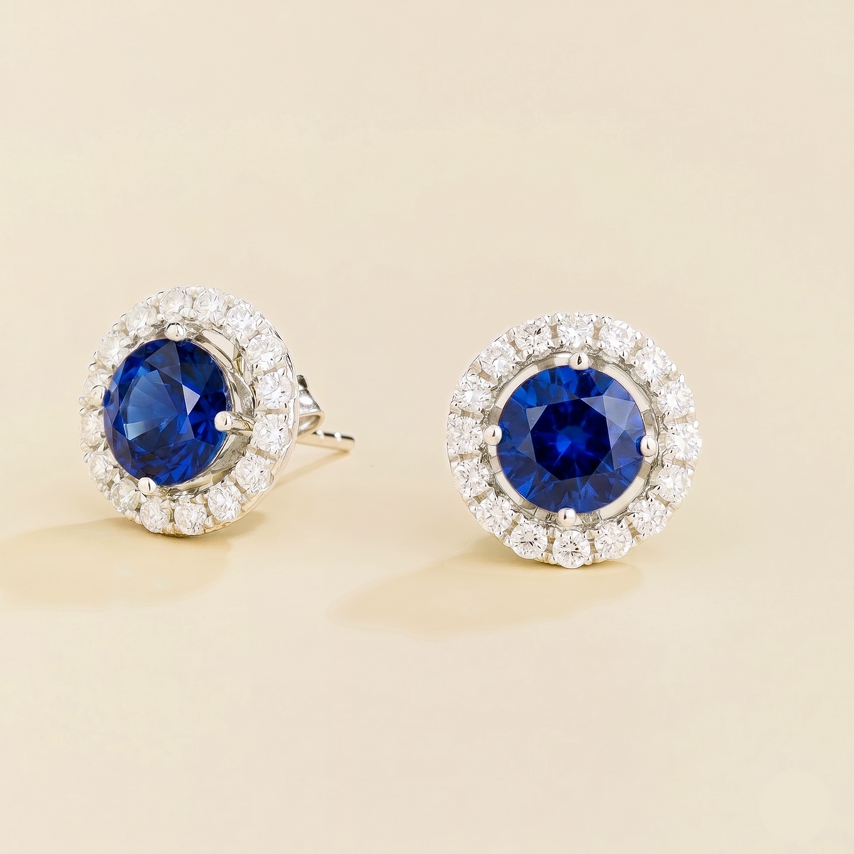 Floret round lab-grown blue sapphire and diamond halo stud earrings in white gold – side | Juvetti London
