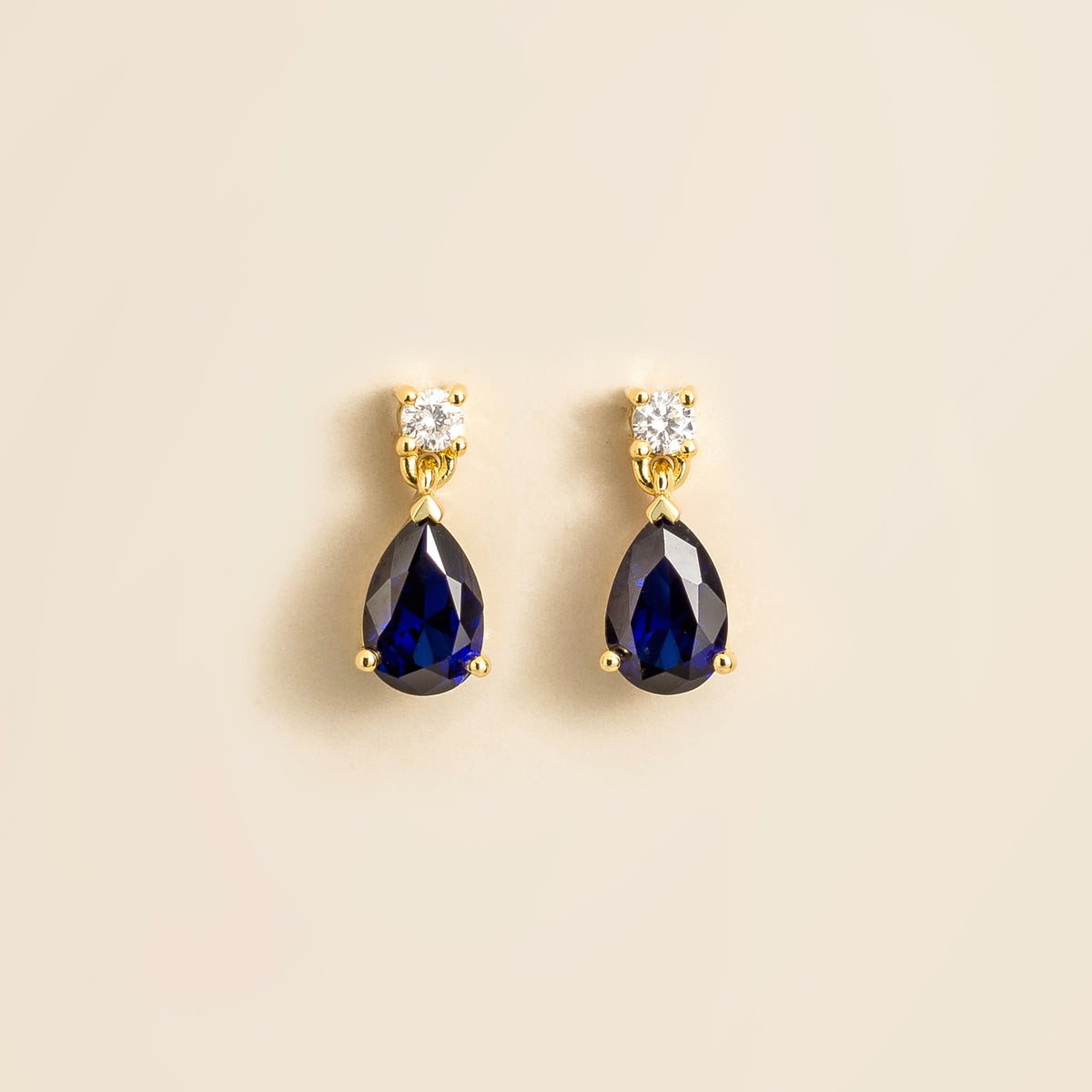 Lab-grown blue sapphire and diamond pear drop earrings in gold – front view | Pisa by Juvetti