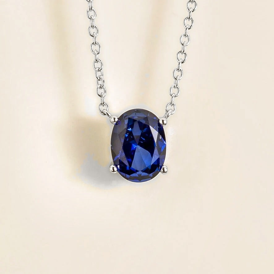 Ovo Blue Sapphire Oval Solitaire Pendant Necklace in White Gold