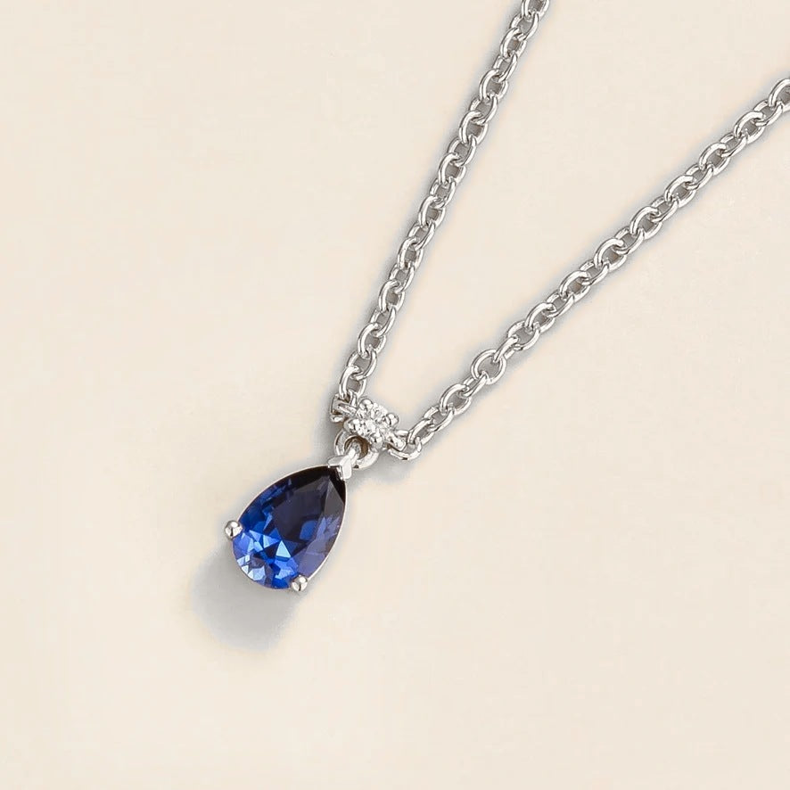 Lab-grown blue sapphire and diamond pear drop pendant necklace in white gold, small – angled view | Pisa by Juvetti