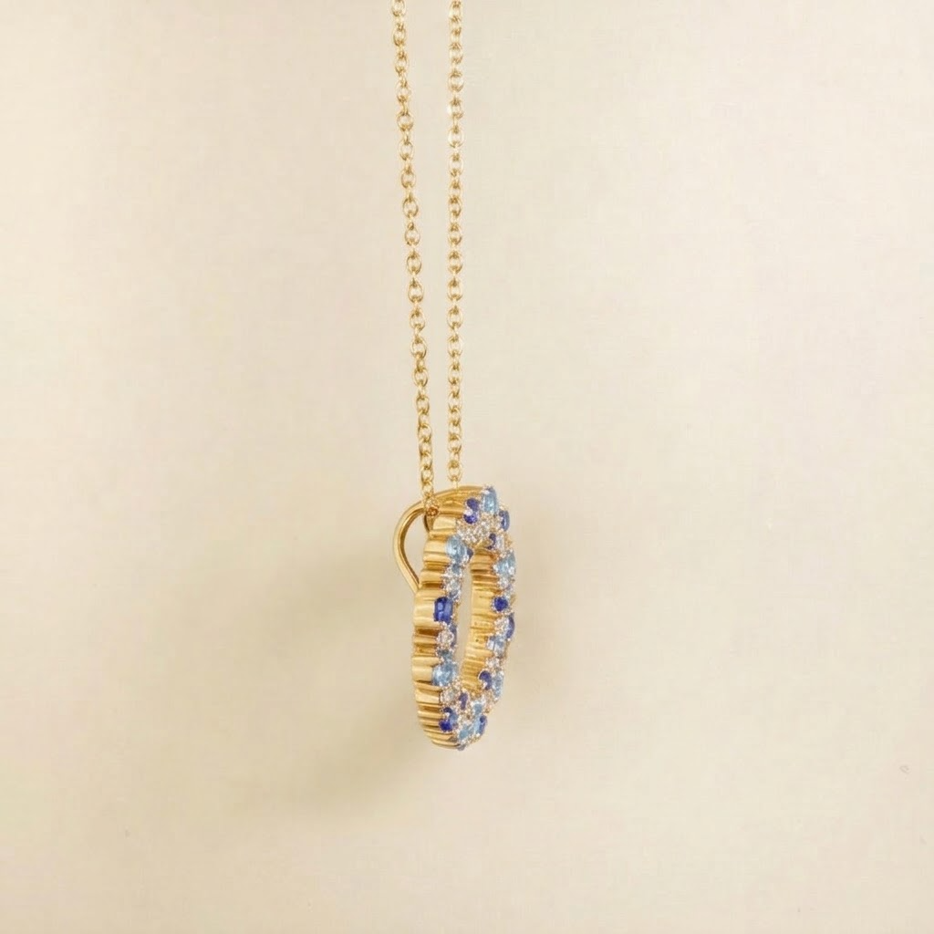 Starry blue sapphire and diamond eternity circle pendant necklace in gold, side view