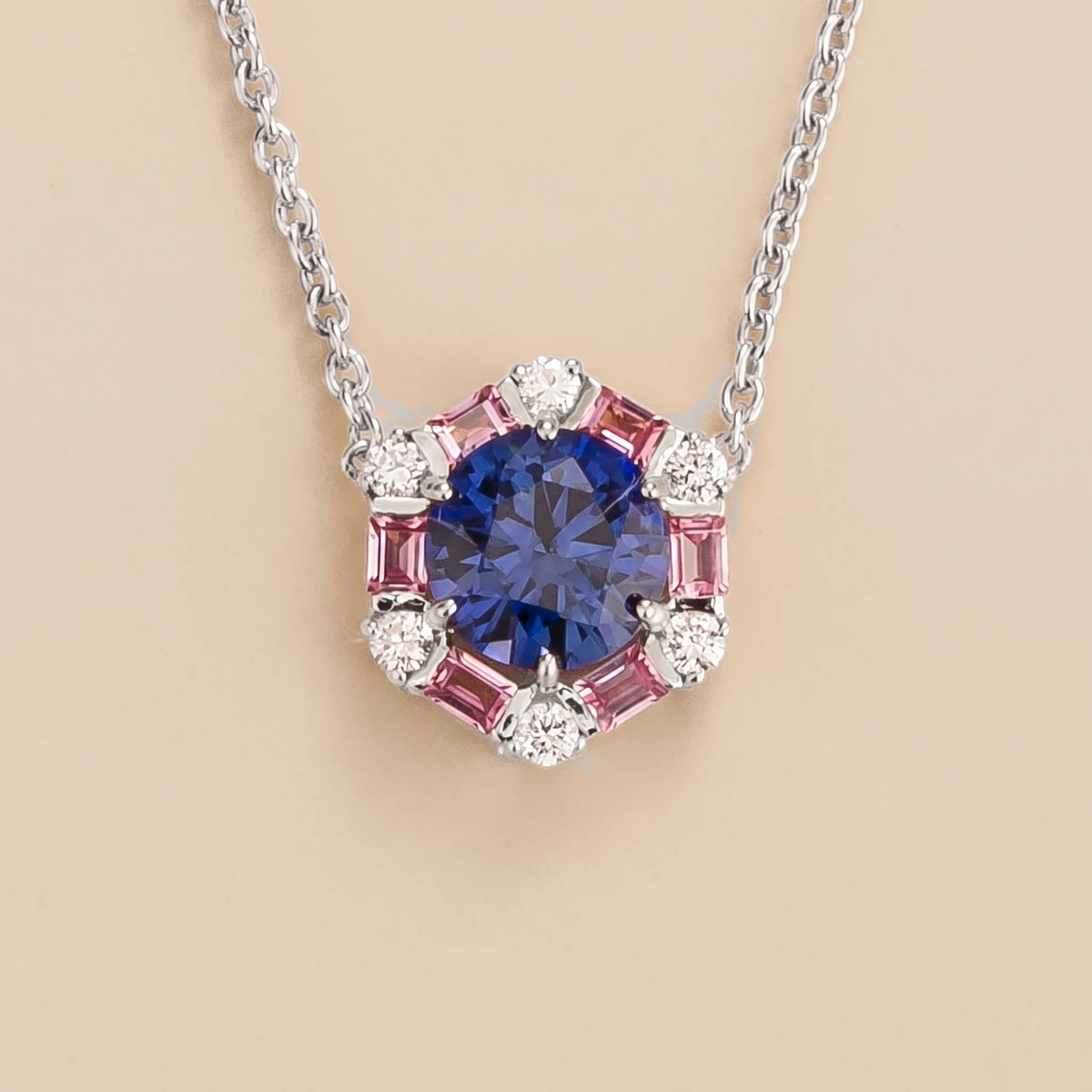 Hexagon halo lab-grown blue sapphire, pink sapphire and diamond pendant necklace, Melba design in white gold | Juvetti London