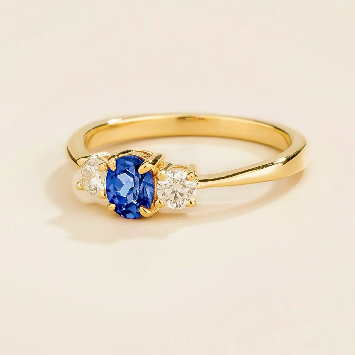 Boble Blue Sapphire Oval & Diamond Three-Stone Ring in Gold – angle view
