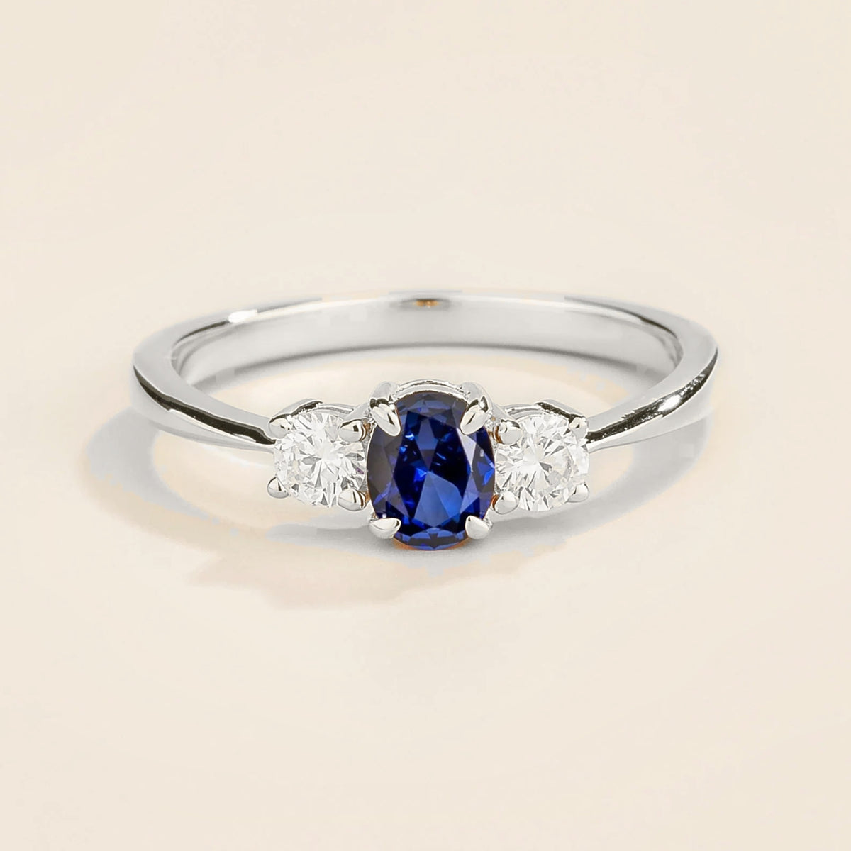 Boble blue sapphire oval & diamond three-stone ring in white gold