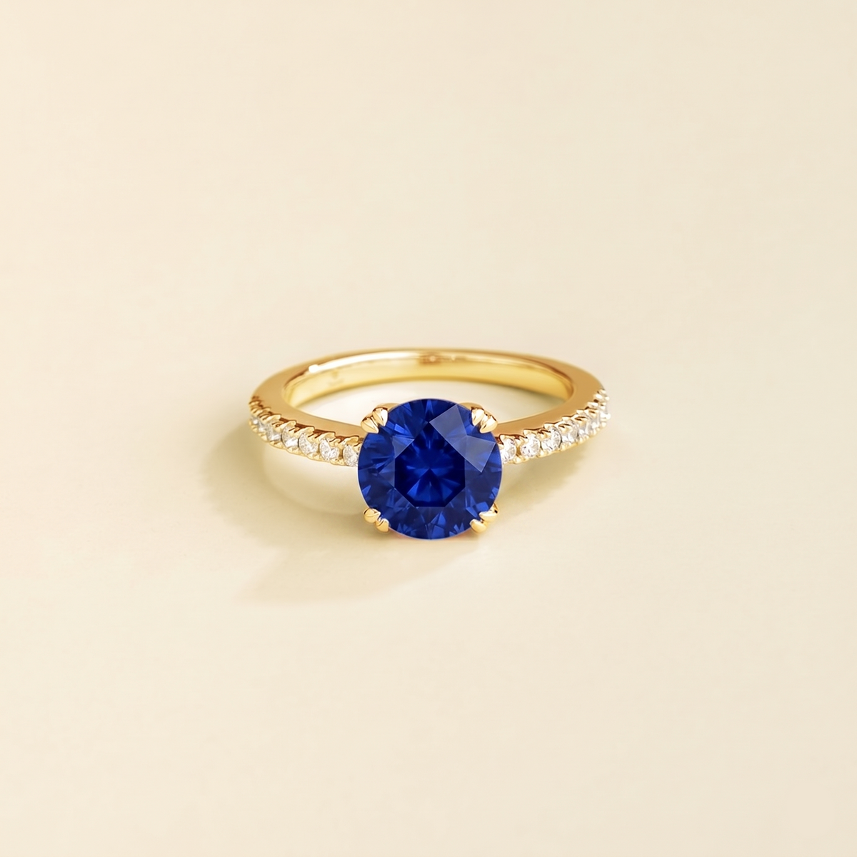 Como round lab-grown blue sapphire solitaire pavé ring in gold – front | Juvetti London