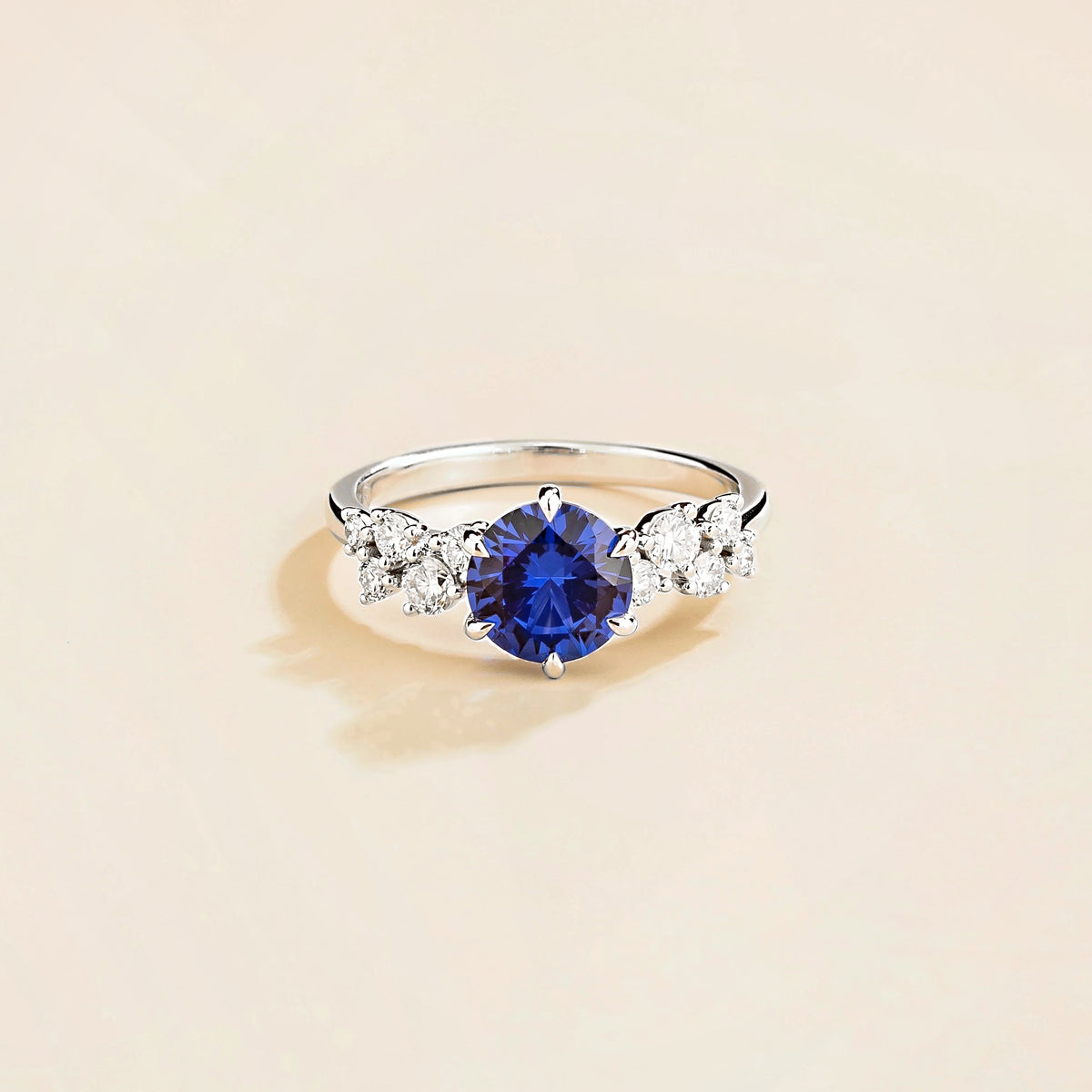 Floret round lab-grown blue sapphire and diamond cluster ring in white gold – front | Juvetti London