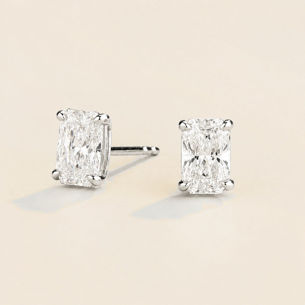 Clair radiant lab-grown diamond solitaire stud earrings in white gold – angled view | Juvetti