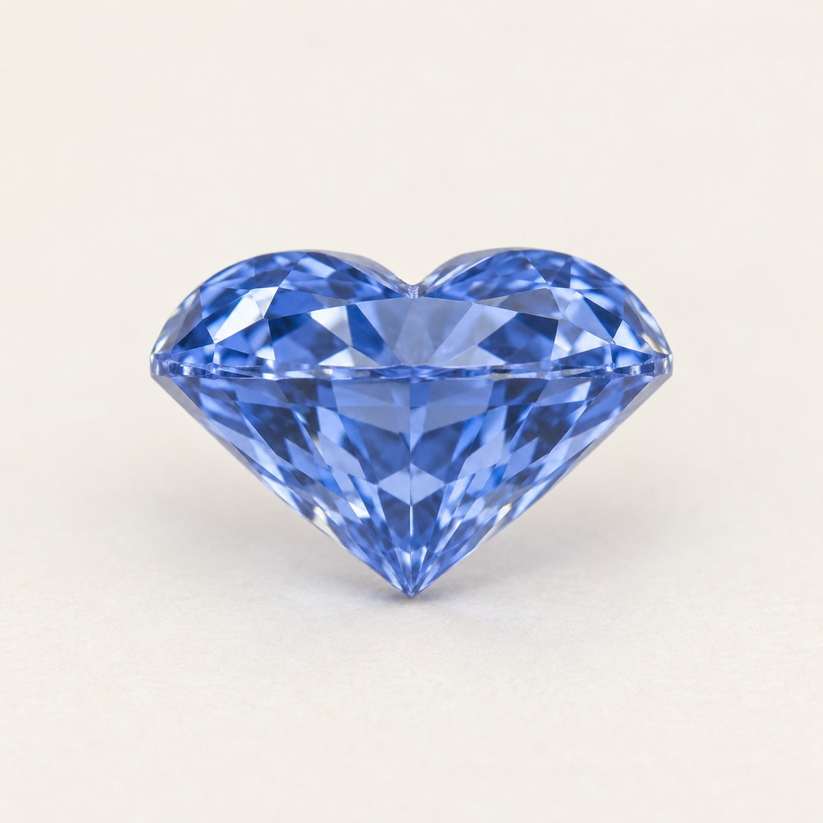 Cornflower blue lab-grown sapphire, heart cut, side view