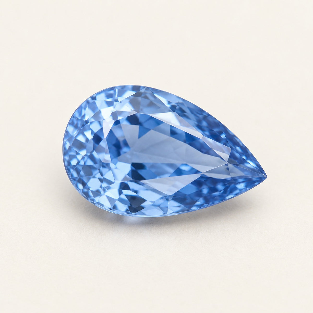 Cornflower blue lab-grown sapphire, pear cut, 45° view