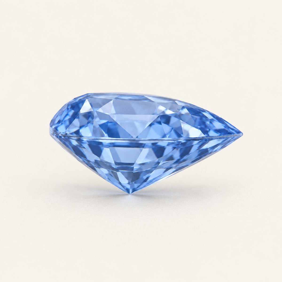 Cornflower blue lab-grown sapphire, pear cut, side view