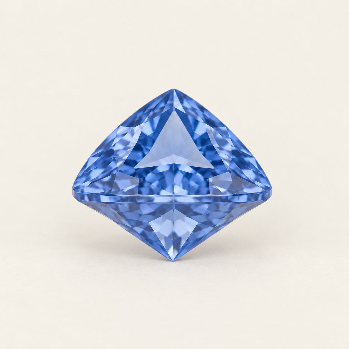 Cornflower blue lab-grown sapphire, trillion cut, side view