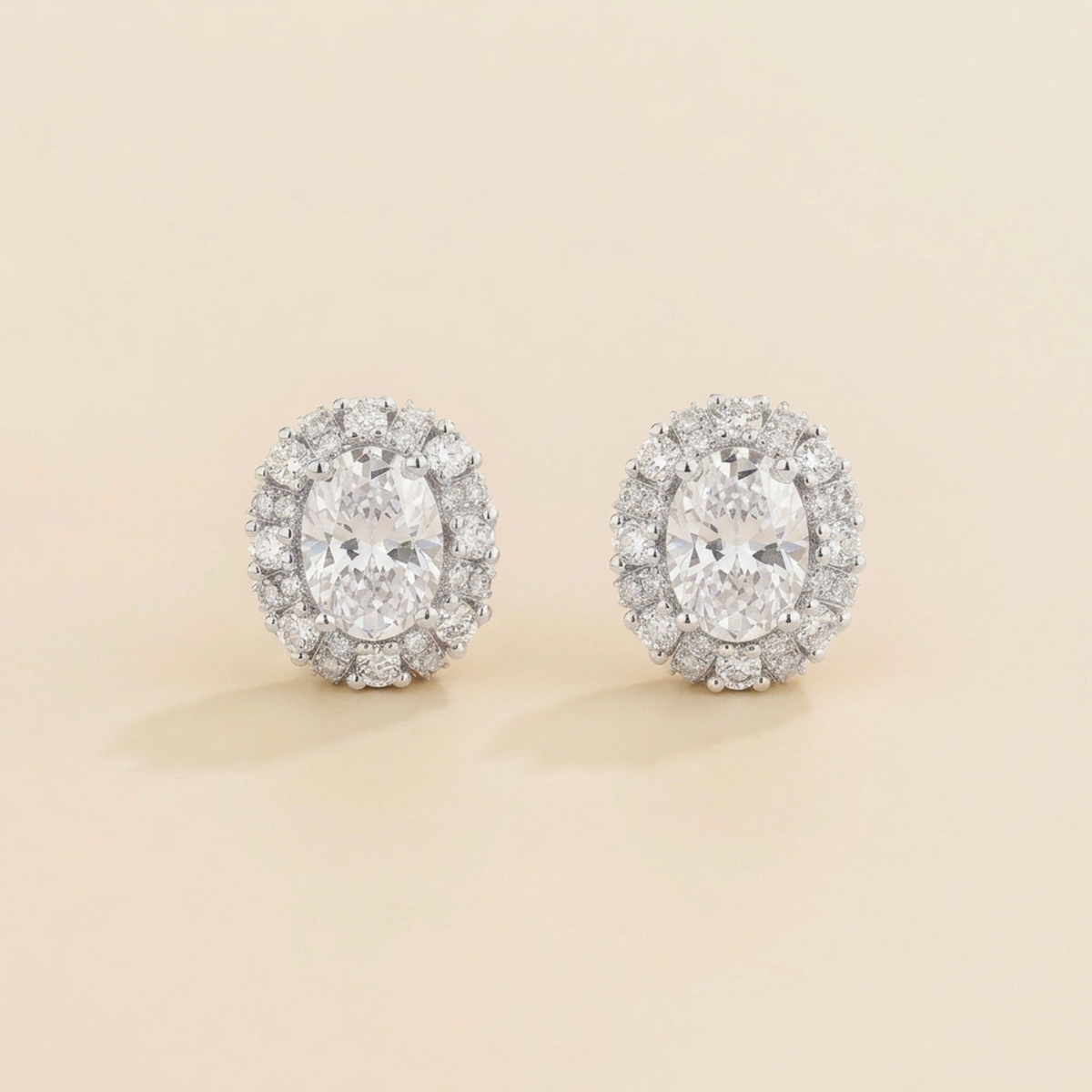 Viva Oval Diamond Halo Stud Earrings in White Gold | Juvetti