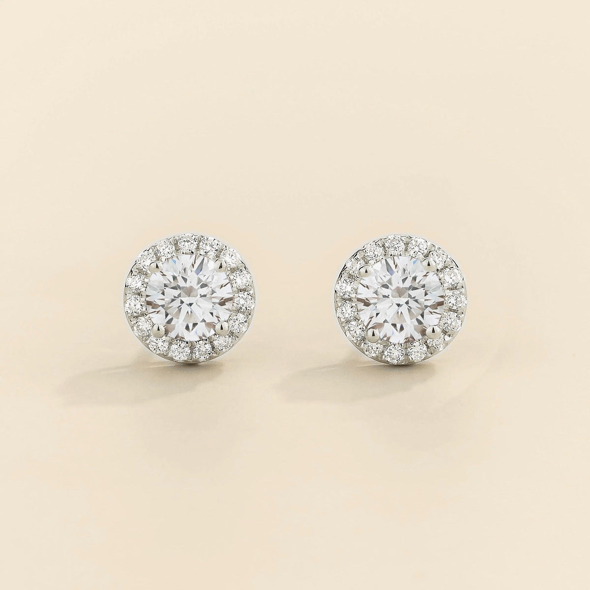 Mars white gold earrings featuring a round lab-grown diamond with diamond halo | Juvetti London