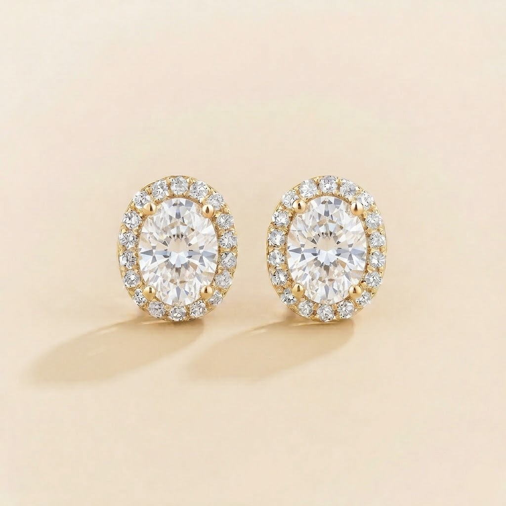 Mina oval diamond halo stud earrings in gold, front view