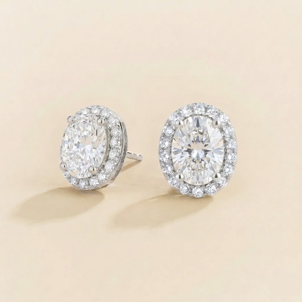 Mina oval diamond halo stud earrings in white gold, side view