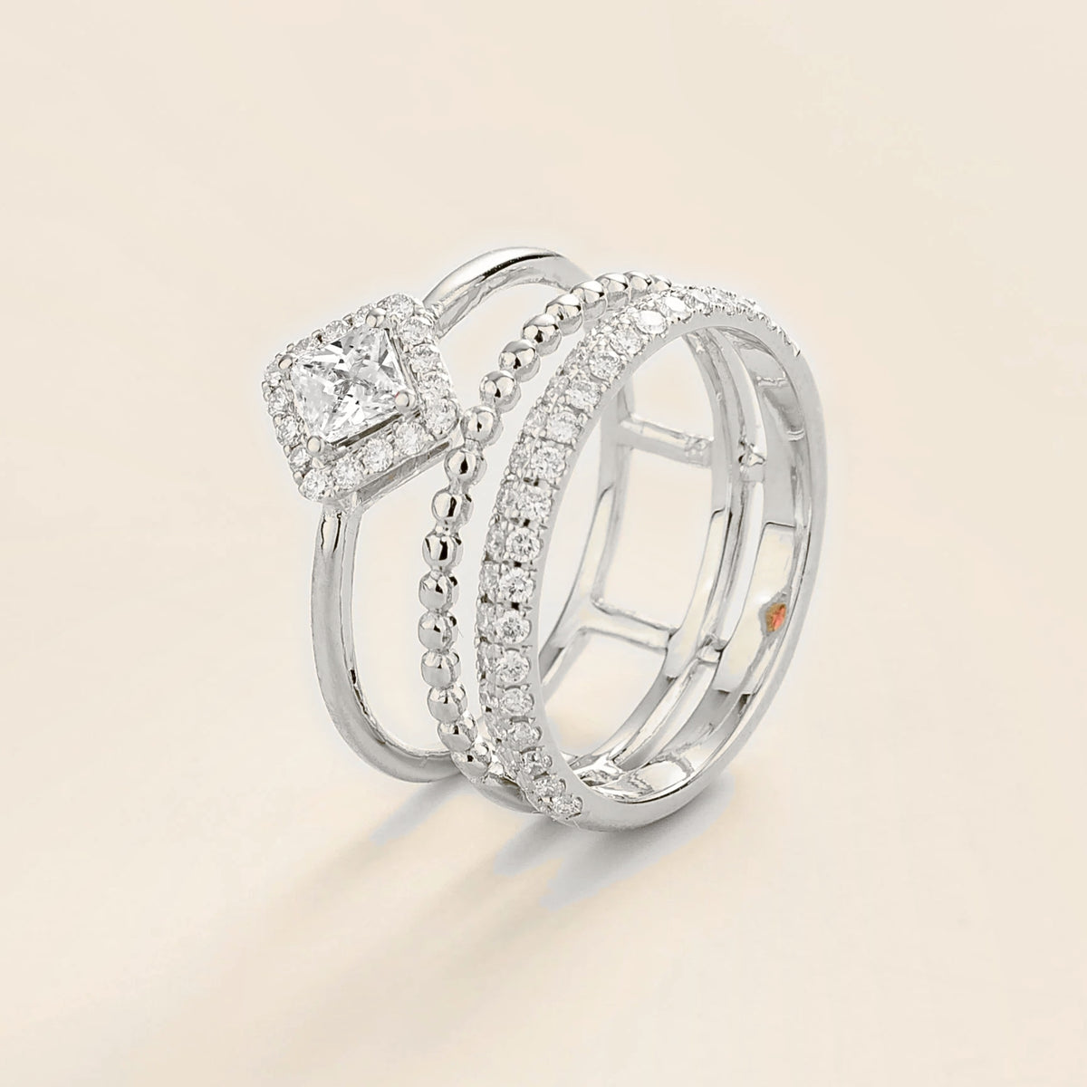 Amici triple-band stacking ring in white gold, princess-cut lab-grown diamond in a diamond halo with beaded and pavé bands, side view | Juvetti London