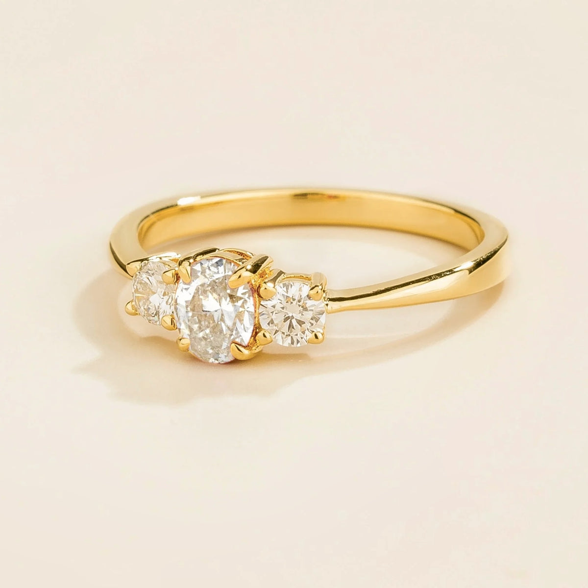 Boble Diamond Oval Three-Stone Ring in Gold – angle view